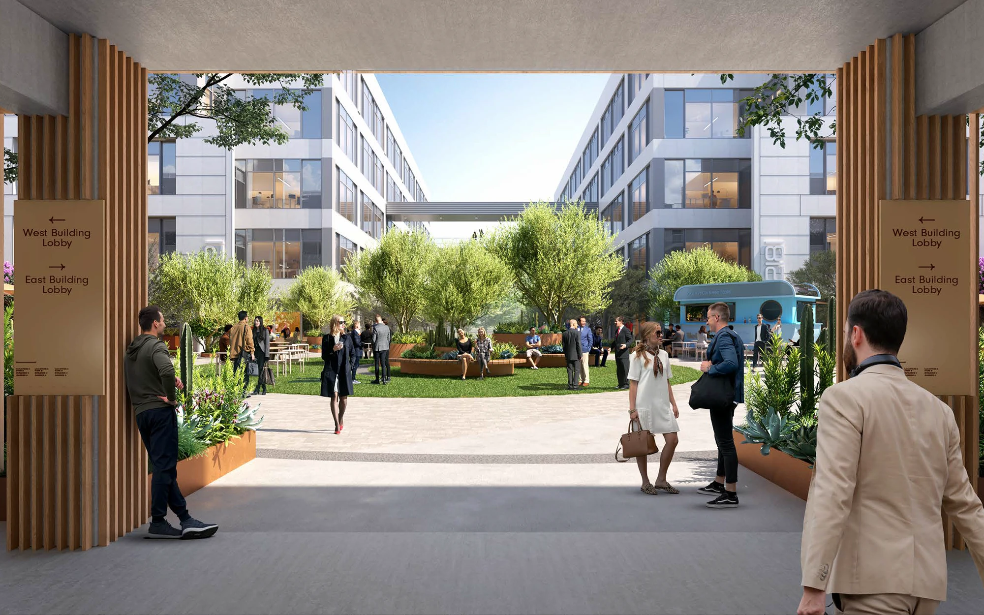 Office park courtyard featuring a lush central garden, seating, and people enjoying the fresh air