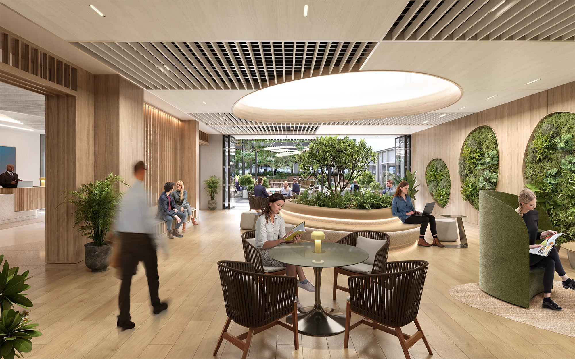 Open-concept workspace with comfortable seating, plants, and natural lighting for relaxation and productivity