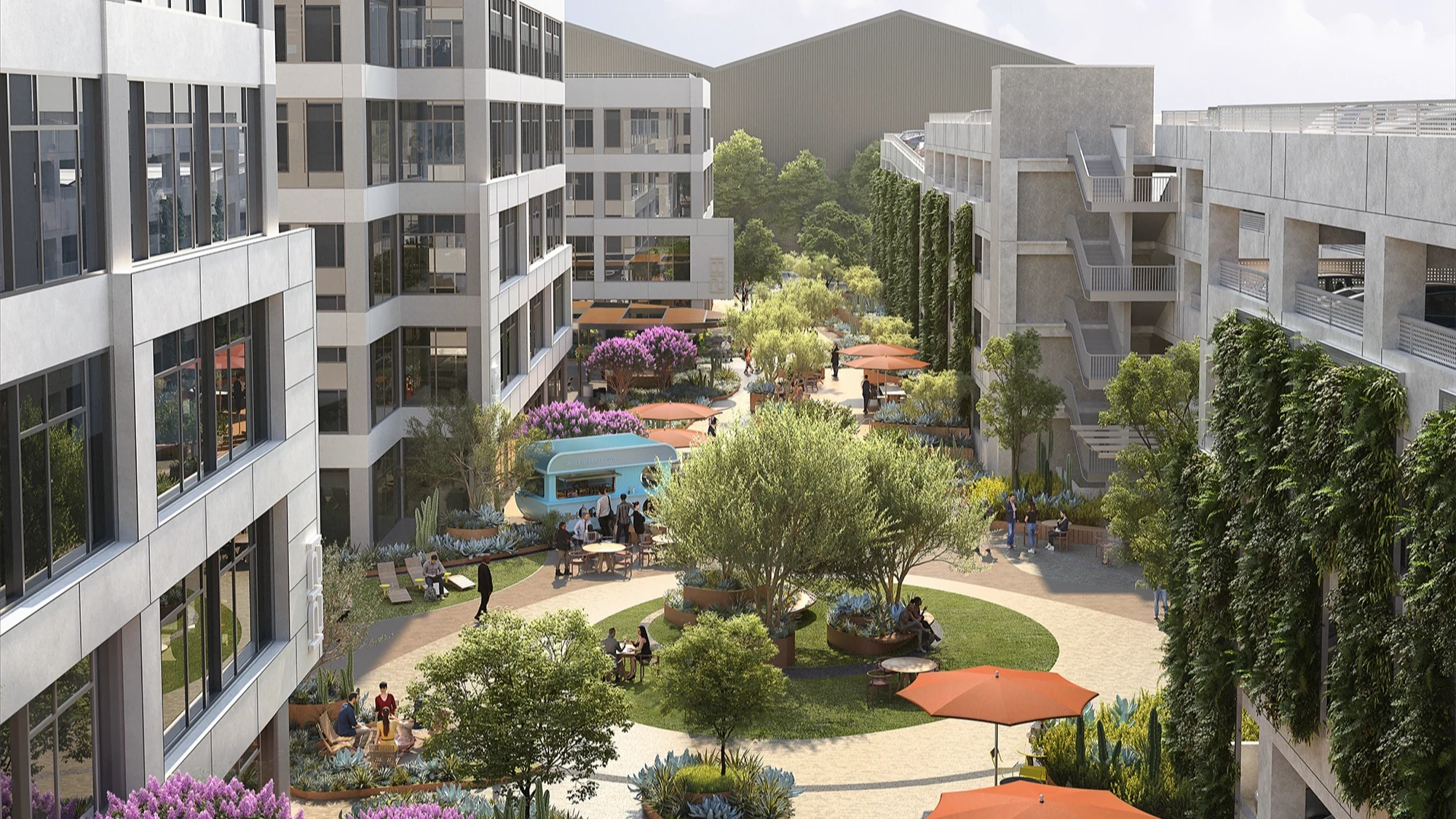 A green office courtyard with trees, seating areas, and a food truck under a bright sky