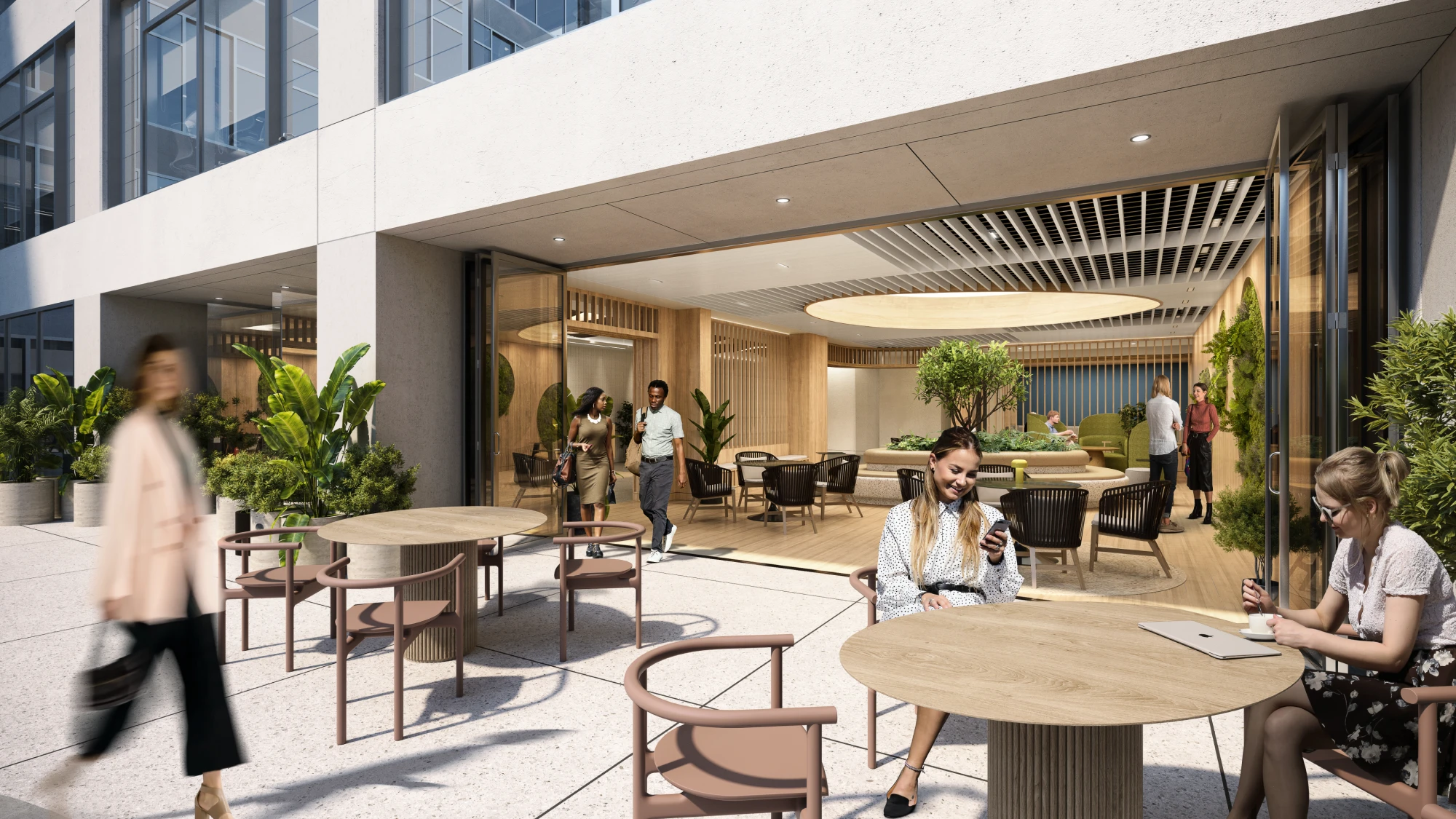 Office patio featuring natural elements, comfortable seating, and people working or socializing